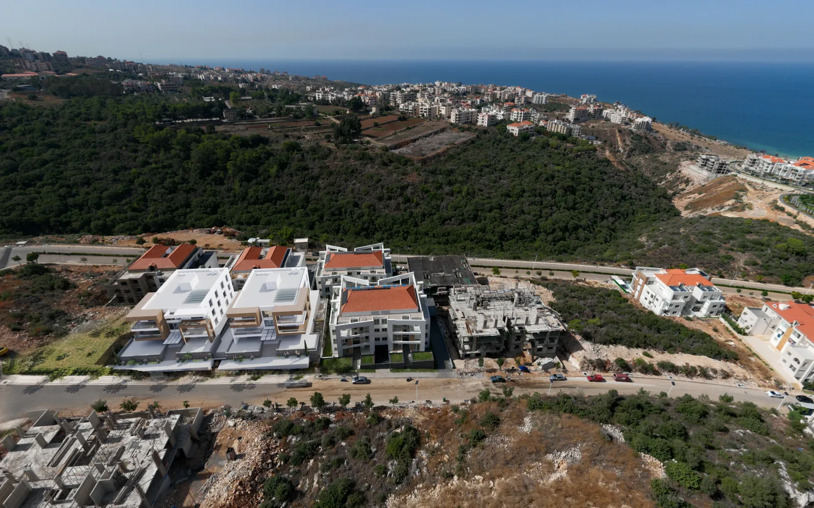 Aerial 360° view of the 4846 project buildings in Medyar, with the sea behind
